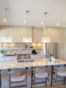 High-end 2026 kitchen design trends showcasing seamless integrated cabinetry and a warm neutral color palette in a custom Kelowna home.