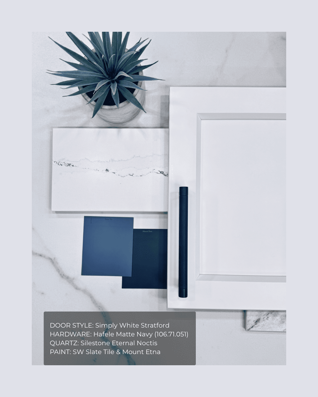 Simply White Stratford shaker cabinets with matte navy hardware and slate tile paint accents.