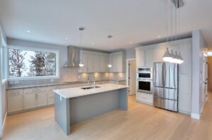 A beautiful, high-end kitchen featuring custom cabinetry, showcasing the lasting value and timeless design of a custom kitchen cabinetry investment in Kelowna.