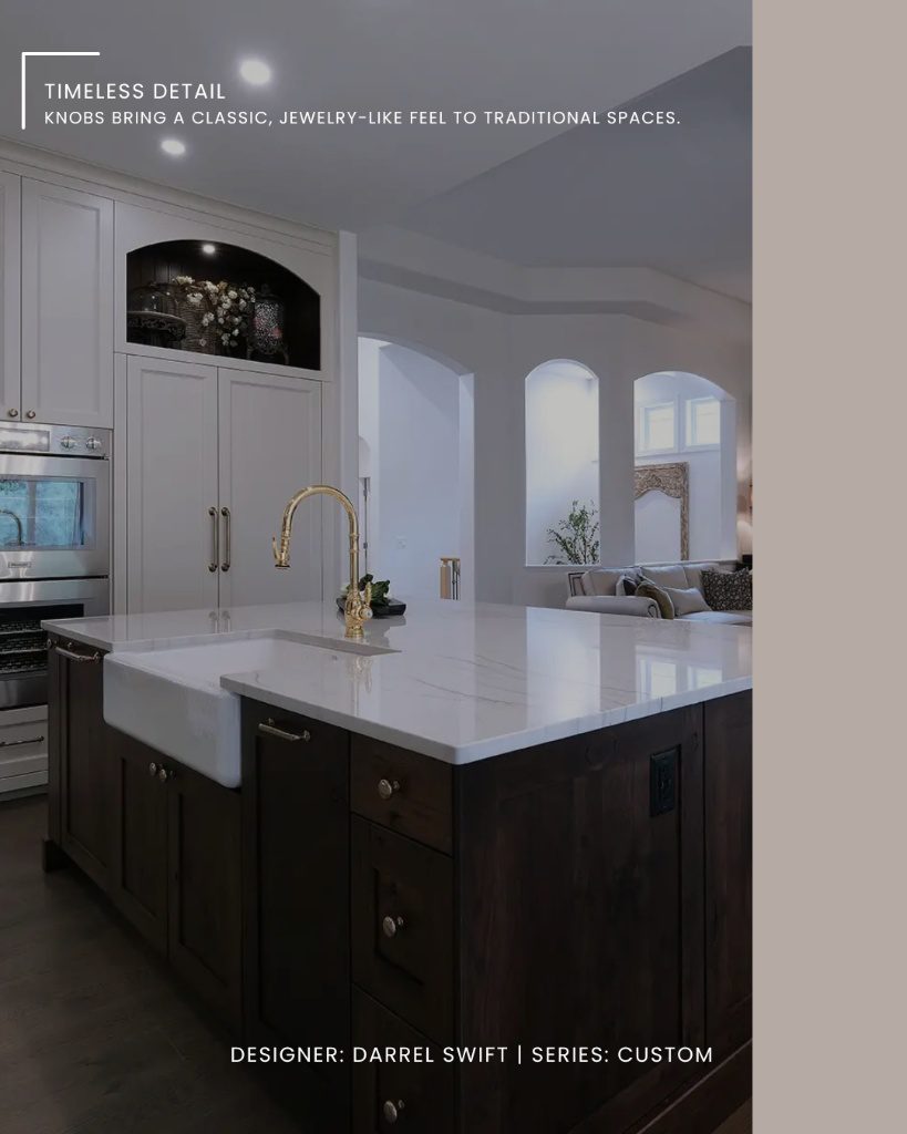 A transitional kitchen featuring dark wood island cabinets with traditional custom cabinetry hardware.