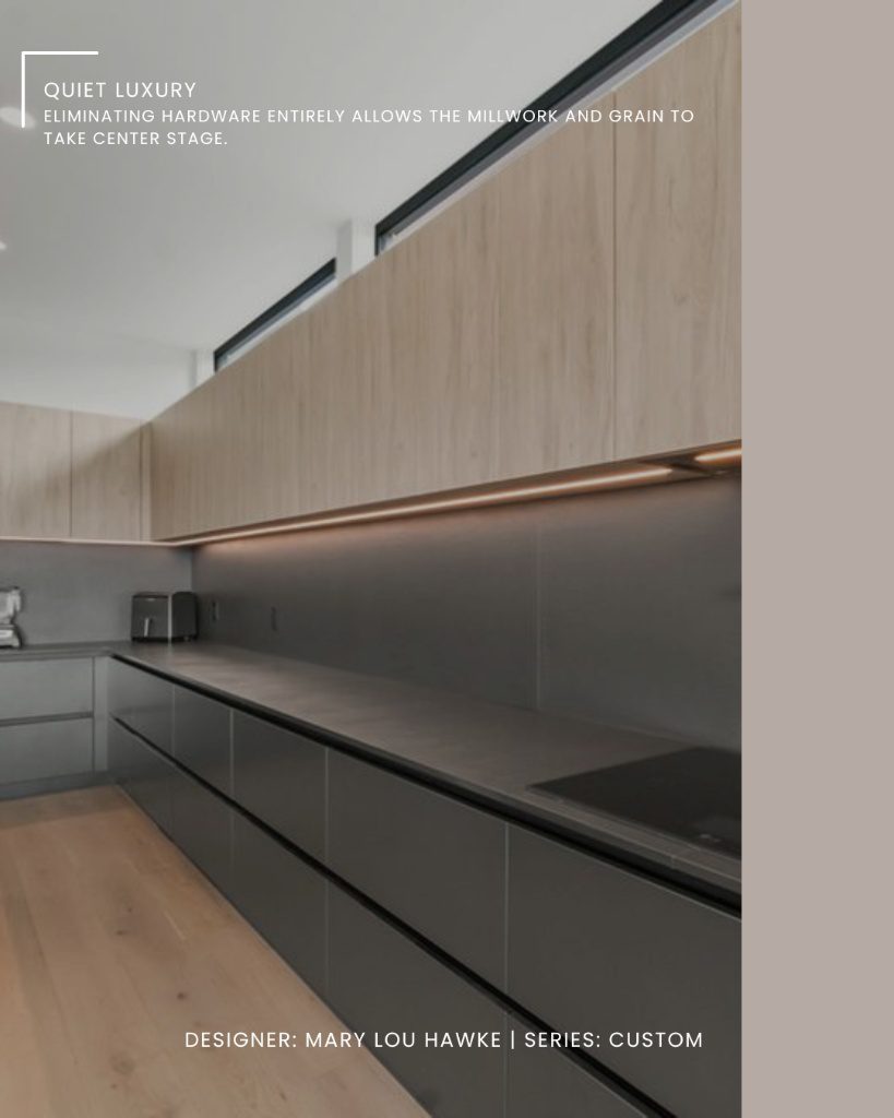 A minimalist kitchen showcasing a seamless design without any visible custom cabinetry hardware.